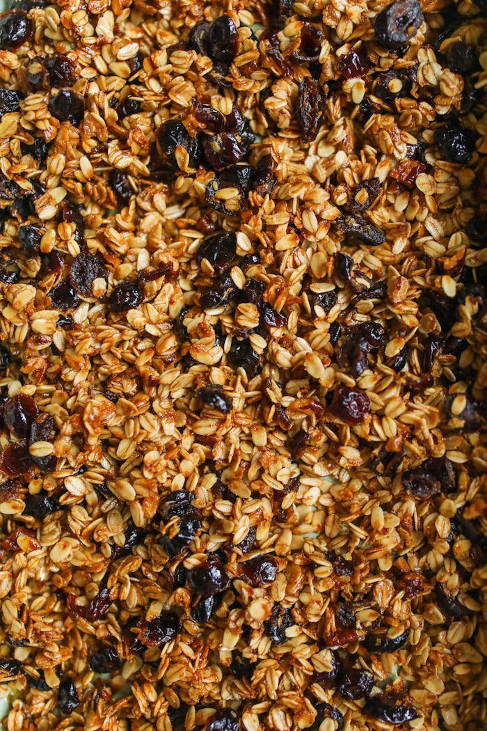 gallery-06 Delicious homemade granola with oats, nuts, and raisins, perfect for a healthy breakfast.